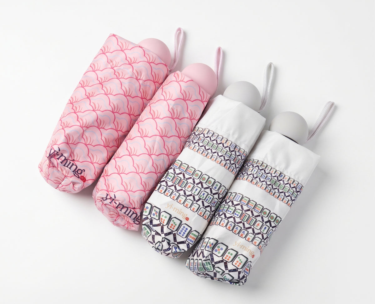 2 sets of patterned folded umbrellas